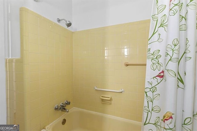 bathroom with shower / bathtub combination with curtain