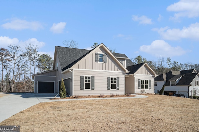 view of front of property with a garage and a front yard