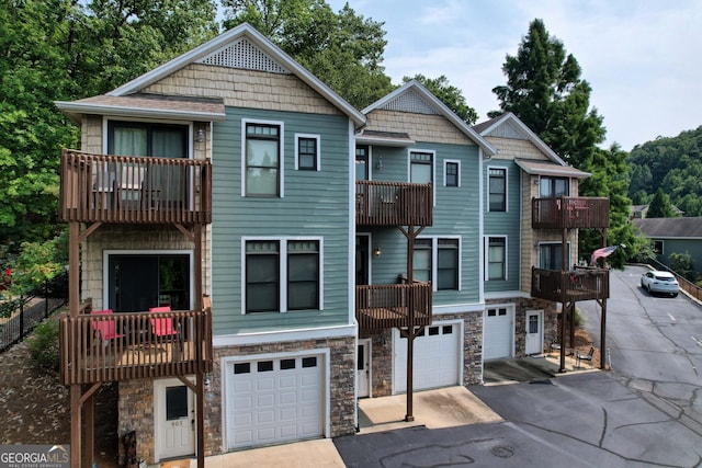 view of front of house featuring a balcony and a garage