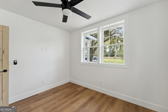 unfurnished room with ceiling fan and light hardwood / wood-style floors