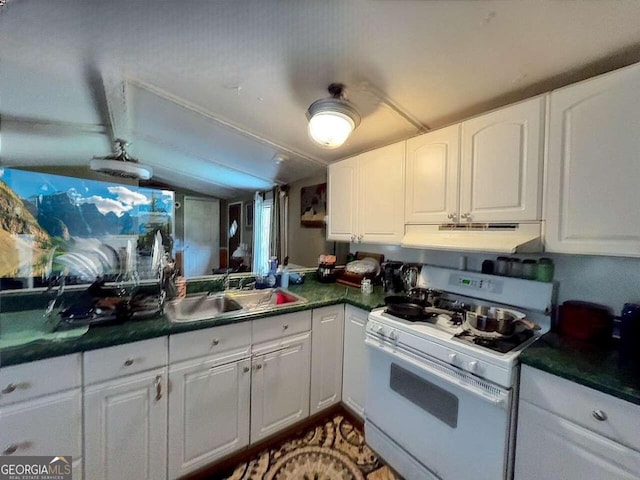 kitchen featuring white gas stove, sink, and white cabinets