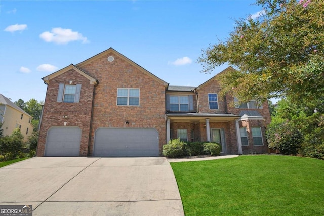 view of front of home featuring a garage and a front lawn