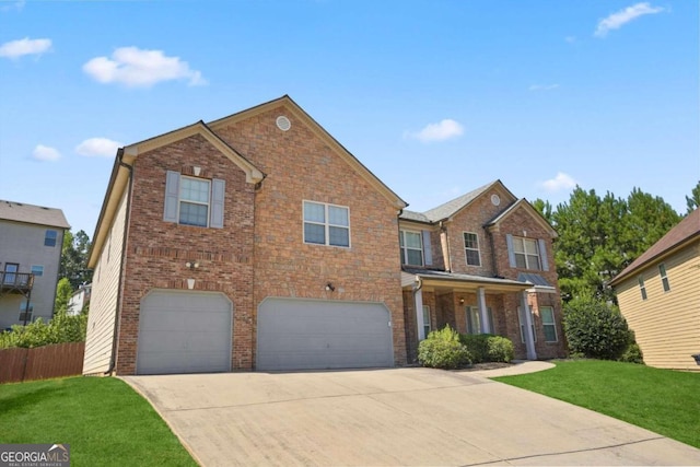 view of front facade with a garage and a front lawn