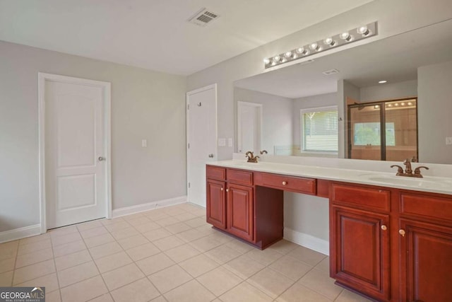 bathroom with tile patterned flooring, vanity, and an enclosed shower