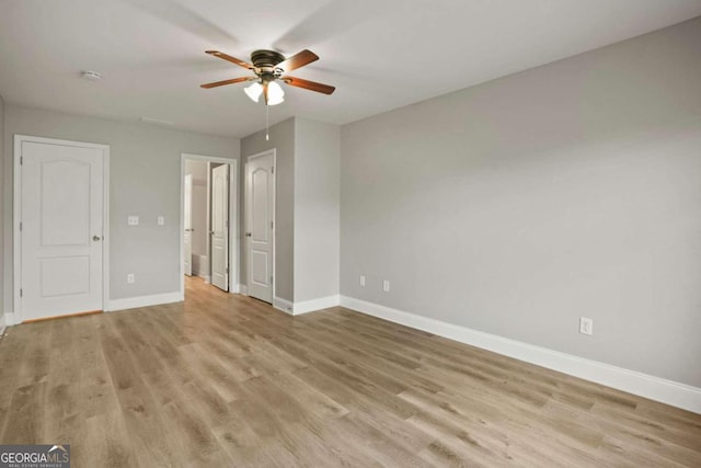 unfurnished bedroom with light wood-type flooring and ceiling fan