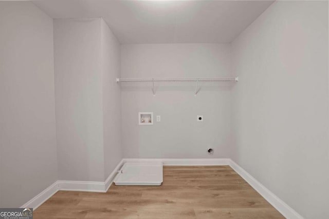 laundry room featuring washer hookup, hardwood / wood-style flooring, and hookup for an electric dryer