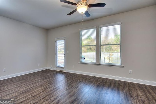 unfurnished room with ceiling fan and dark hardwood / wood-style flooring