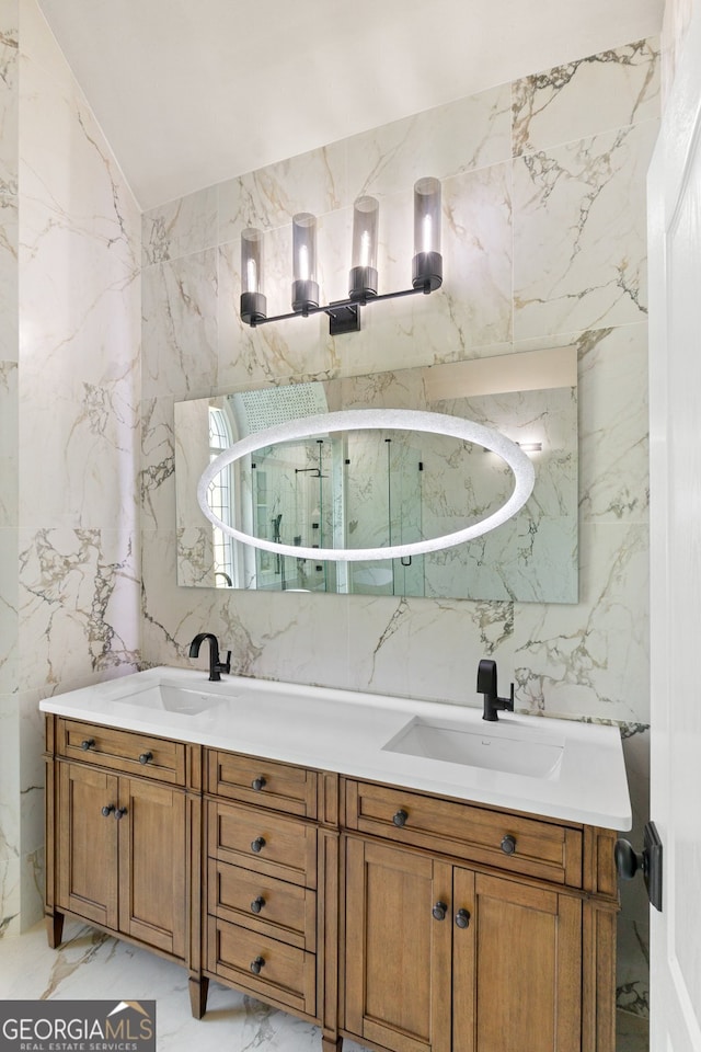 bathroom with vanity and tile walls