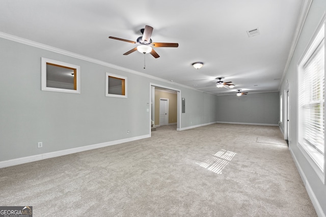 unfurnished room featuring ceiling fan, ornamental molding, and light carpet