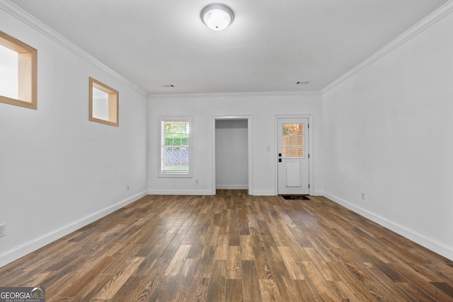 entryway featuring ornamental molding and dark hardwood / wood-style flooring