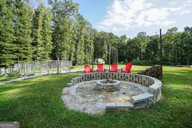 view of yard featuring an outdoor fire pit