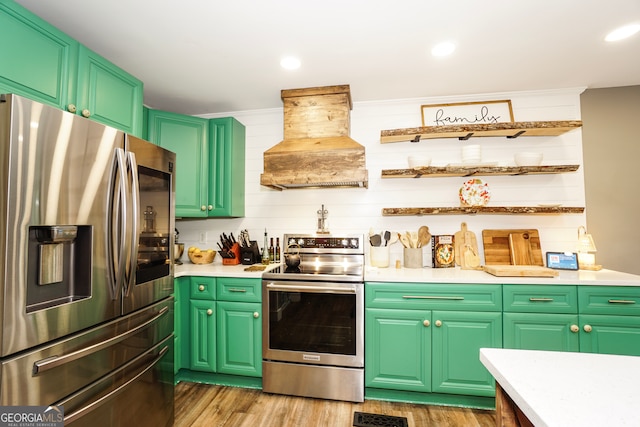 kitchen with green cabinetry, stainless steel appliances, custom exhaust hood, and light hardwood / wood-style floors