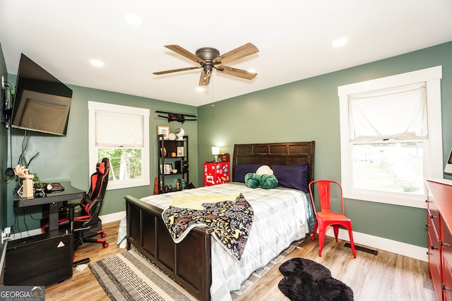 bedroom featuring ceiling fan and light wood-type flooring