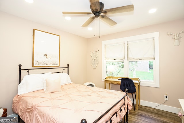 bedroom featuring ceiling fan and dark hardwood / wood-style flooring