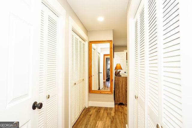 corridor featuring dark hardwood / wood-style floors