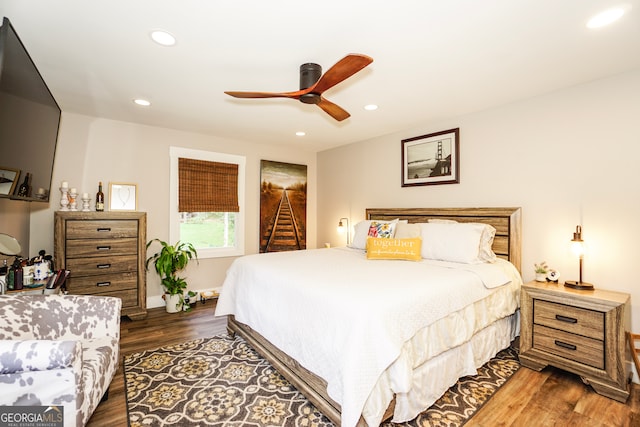 bedroom featuring dark hardwood / wood-style flooring and ceiling fan