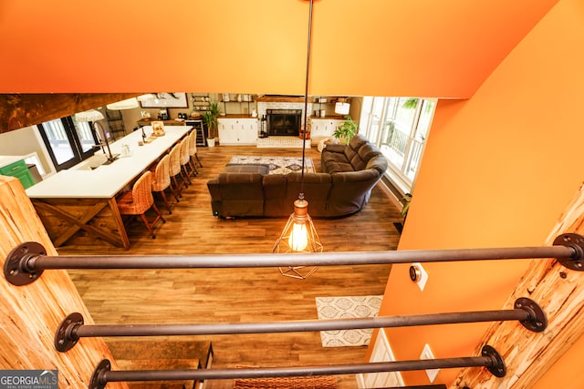 interior space featuring wood-type flooring and a fireplace