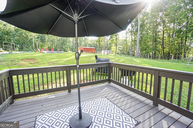 wooden terrace with a yard