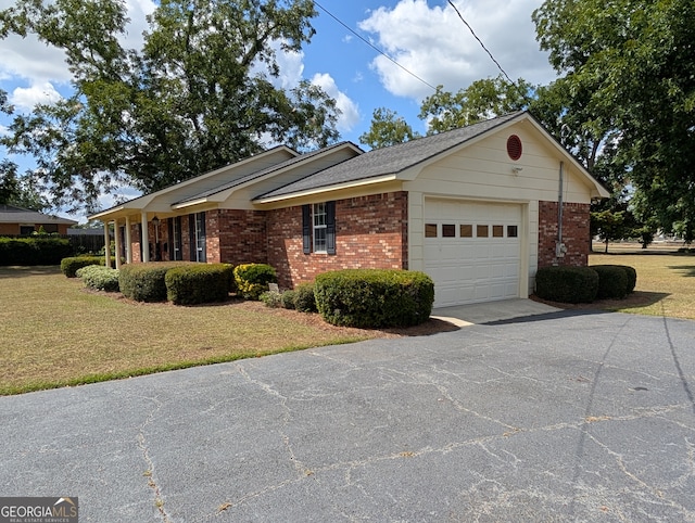 view of front facade with a front lawn and a garage