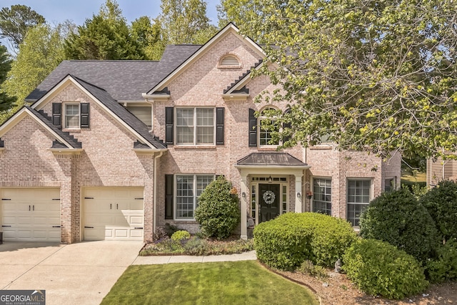 view of front of property with a garage