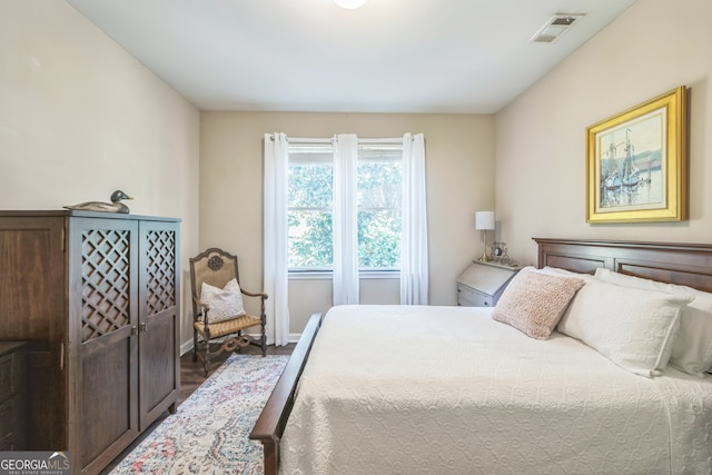 bedroom featuring dark wood-type flooring