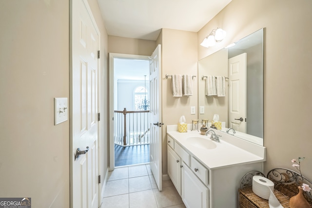 bathroom featuring tile patterned flooring and vanity