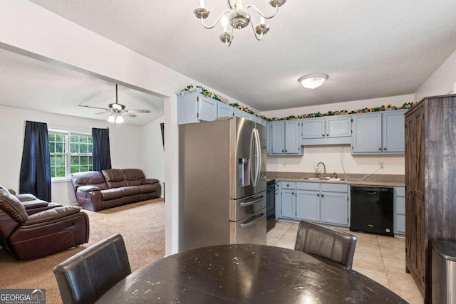 kitchen featuring a textured ceiling, ceiling fan with notable chandelier, dishwasher, stainless steel fridge with ice dispenser, and sink