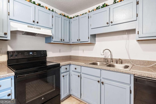 kitchen with black appliances, light tile patterned floors, a textured ceiling, and sink