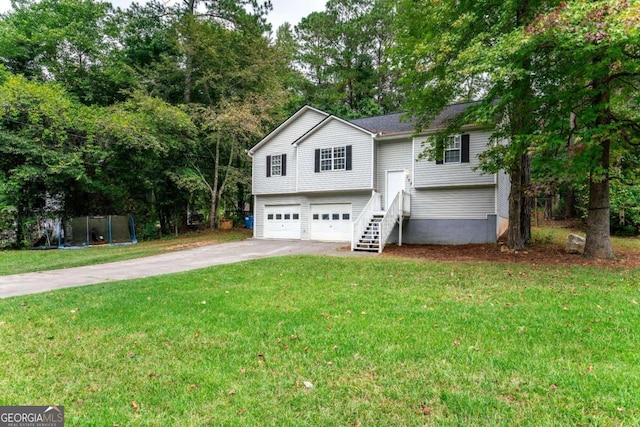 split foyer home with a garage and a front yard