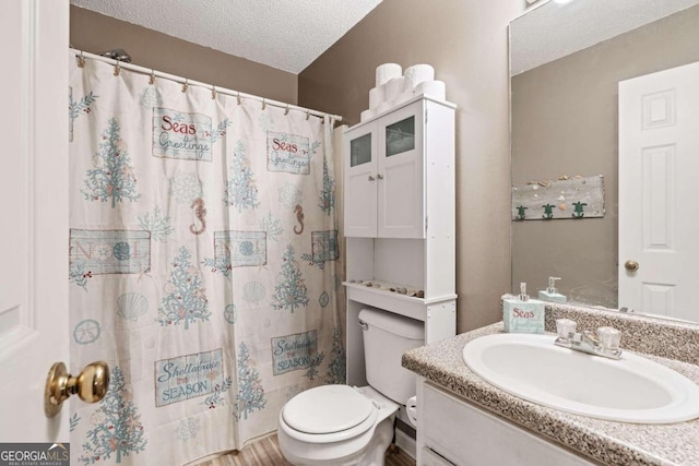 bathroom with hardwood / wood-style floors, toilet, a shower with curtain, vanity, and a textured ceiling