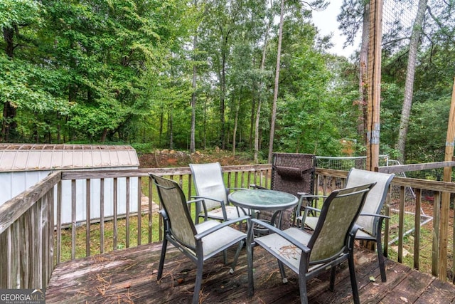 deck featuring a storage shed