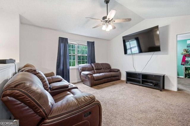 living room with ceiling fan, light colored carpet, a textured ceiling, and vaulted ceiling