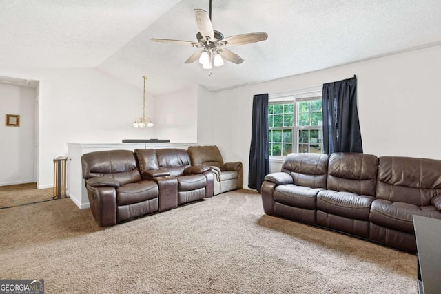 living room with a textured ceiling, vaulted ceiling, ceiling fan with notable chandelier, and carpet floors