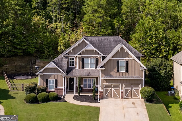 view of front of house featuring a garage and a front yard