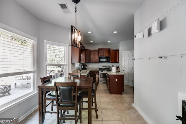 tiled dining area featuring sink