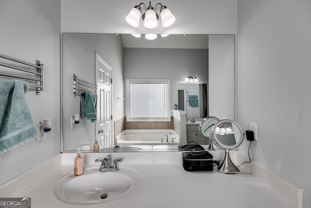 bathroom with vanity and a tub