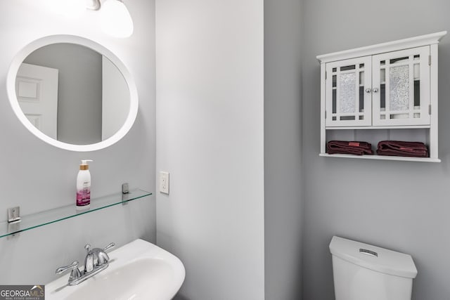 bathroom with sink and toilet