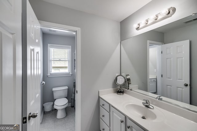 bathroom with vanity and toilet