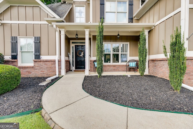 property entrance with covered porch