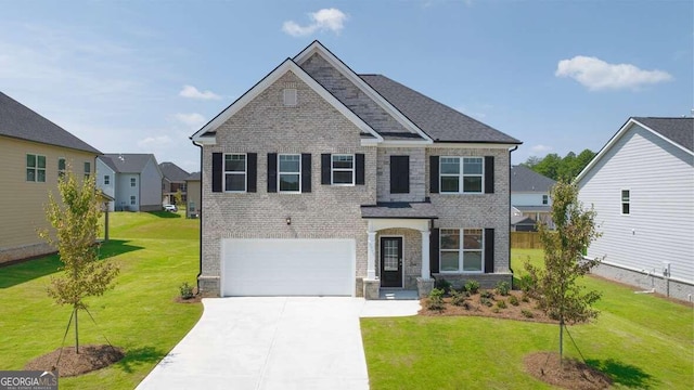 view of front facade with a garage and a front yard