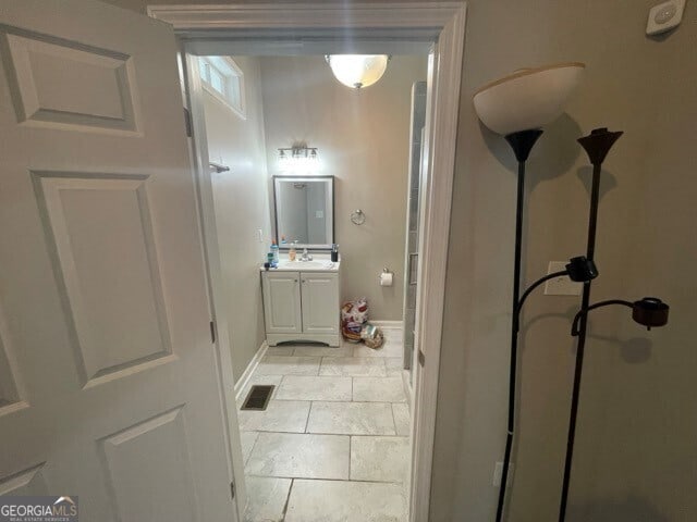 bathroom with vanity and tile patterned floors