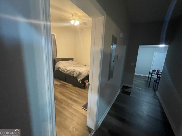 corridor with wood-type flooring