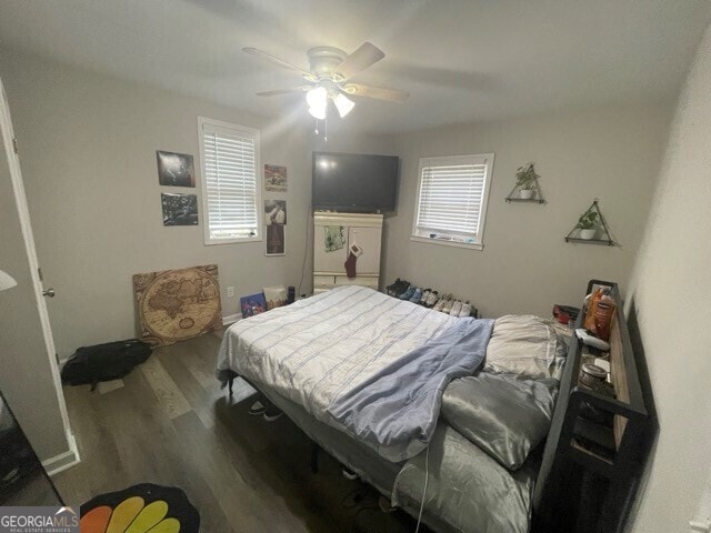 bedroom with ceiling fan and hardwood / wood-style flooring