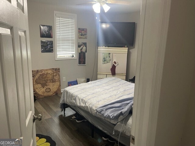 bedroom with hardwood / wood-style flooring and ceiling fan