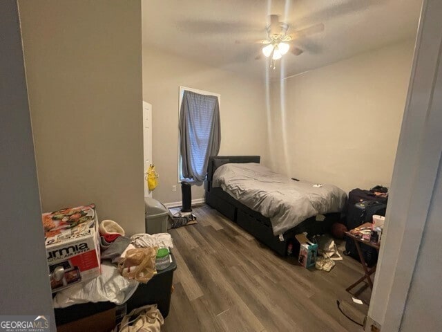 bedroom featuring ceiling fan and hardwood / wood-style floors