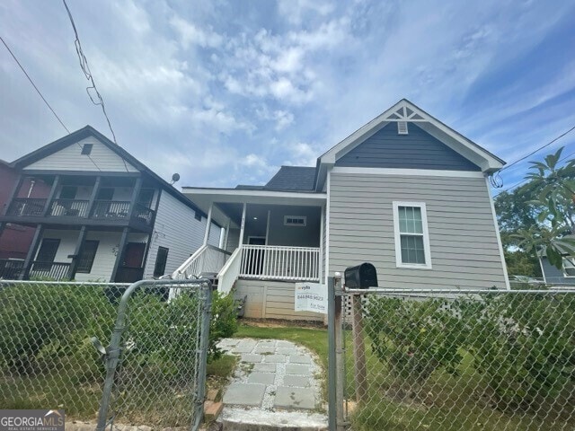 view of front of house featuring a balcony