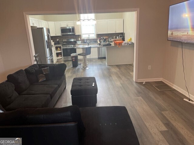 living room with hardwood / wood-style flooring