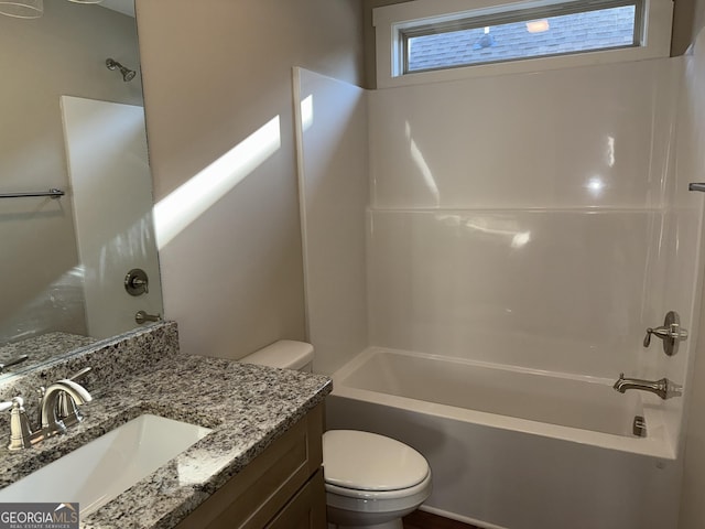 full bathroom featuring shower / washtub combination, toilet, and vanity