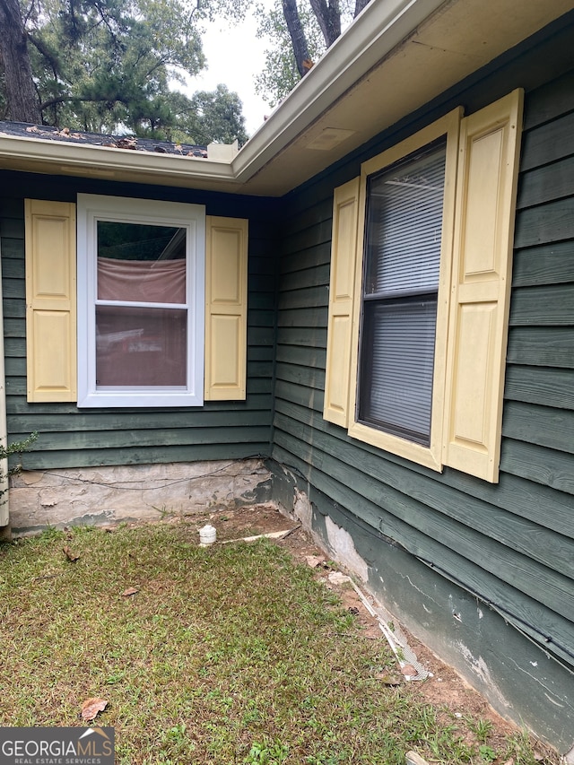 view of home's exterior featuring a yard