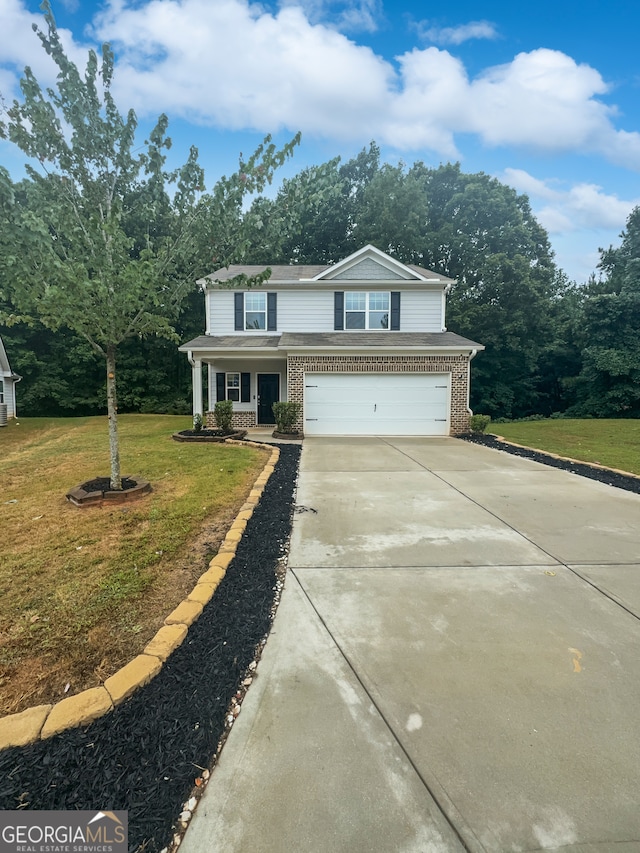 view of front of house with a porch, a garage, and a front lawn